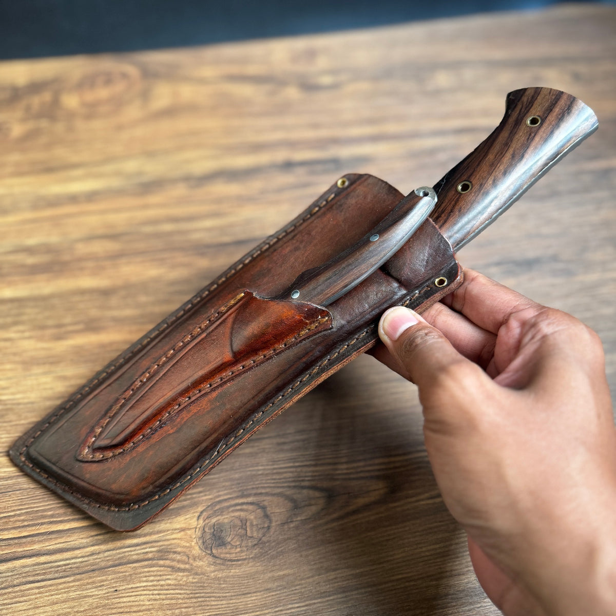 rosewood handle hand-forged meat and bone cleaver knife traditional carved detail view