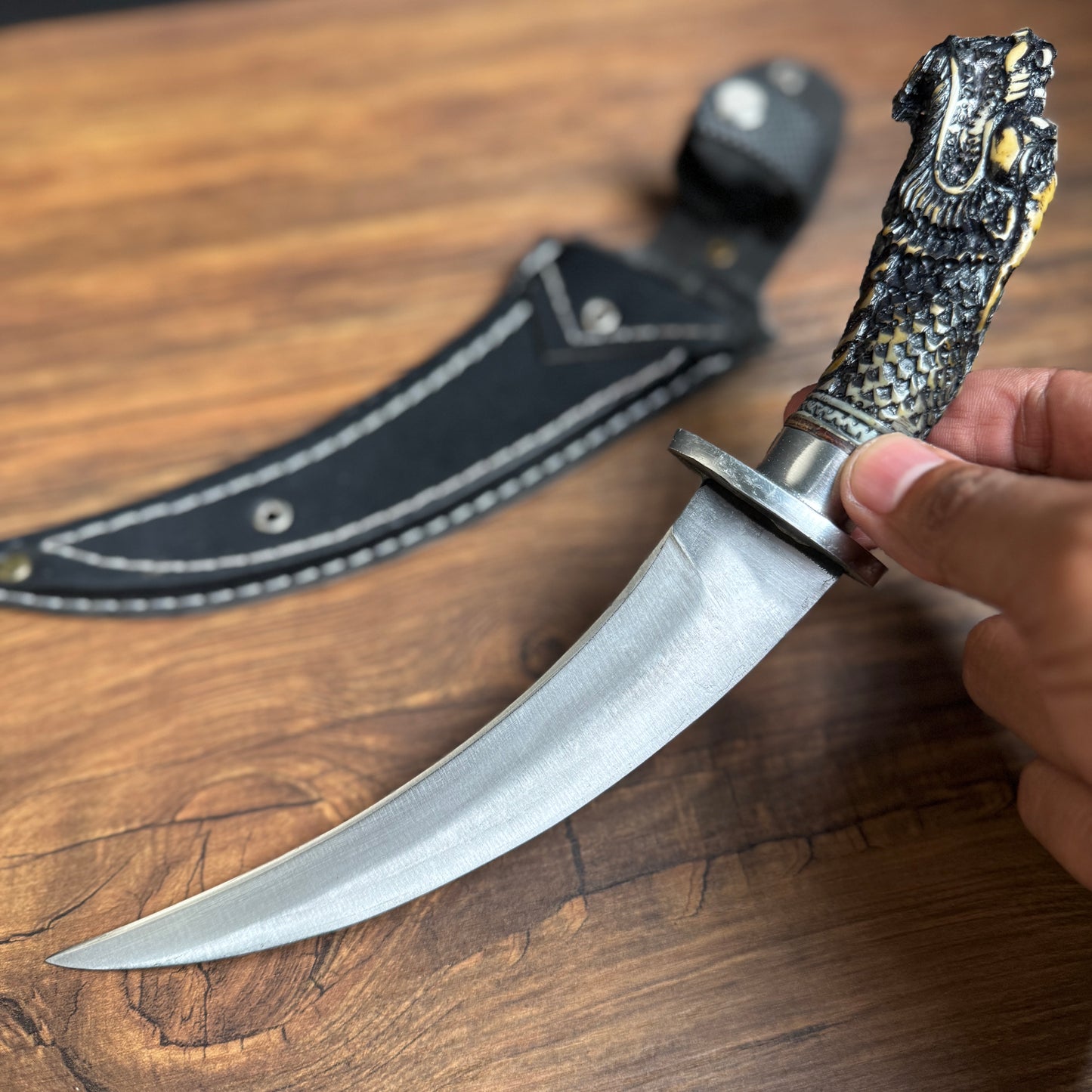 spring steel hunting knife sculpted resin handle traditional detail close up