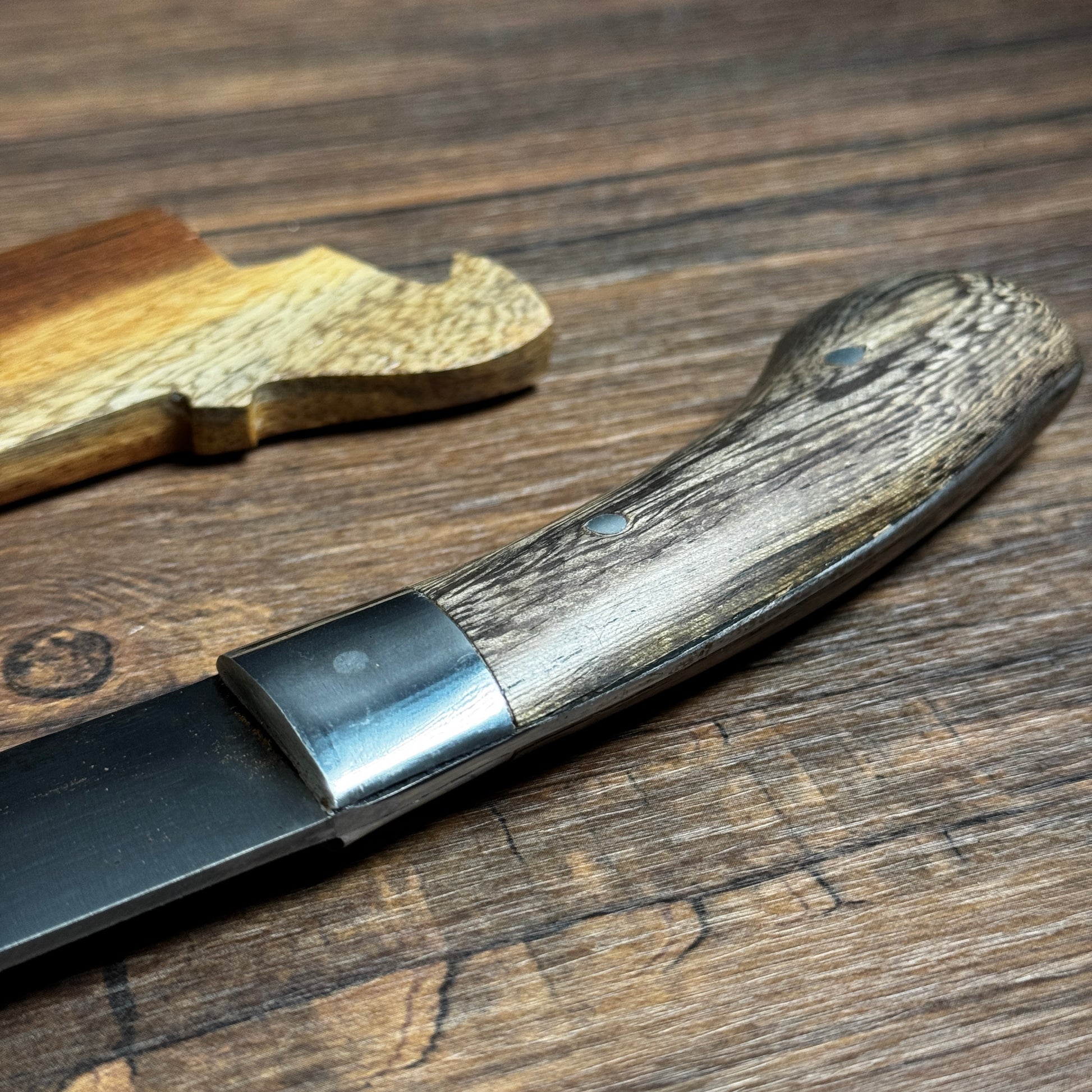 bushcraft knife bushcraft knife hand forged spring steel teak handle close up detail
