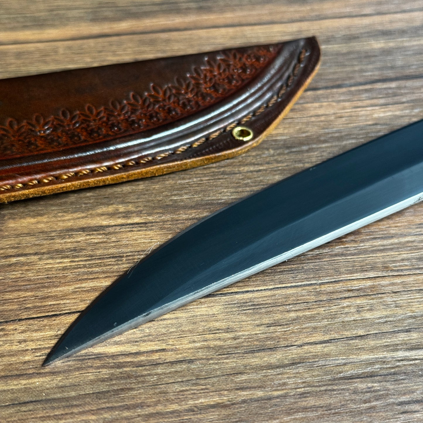 butcher knife with tooled leather sheath