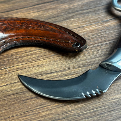 karambit knife with tooled leather sheath