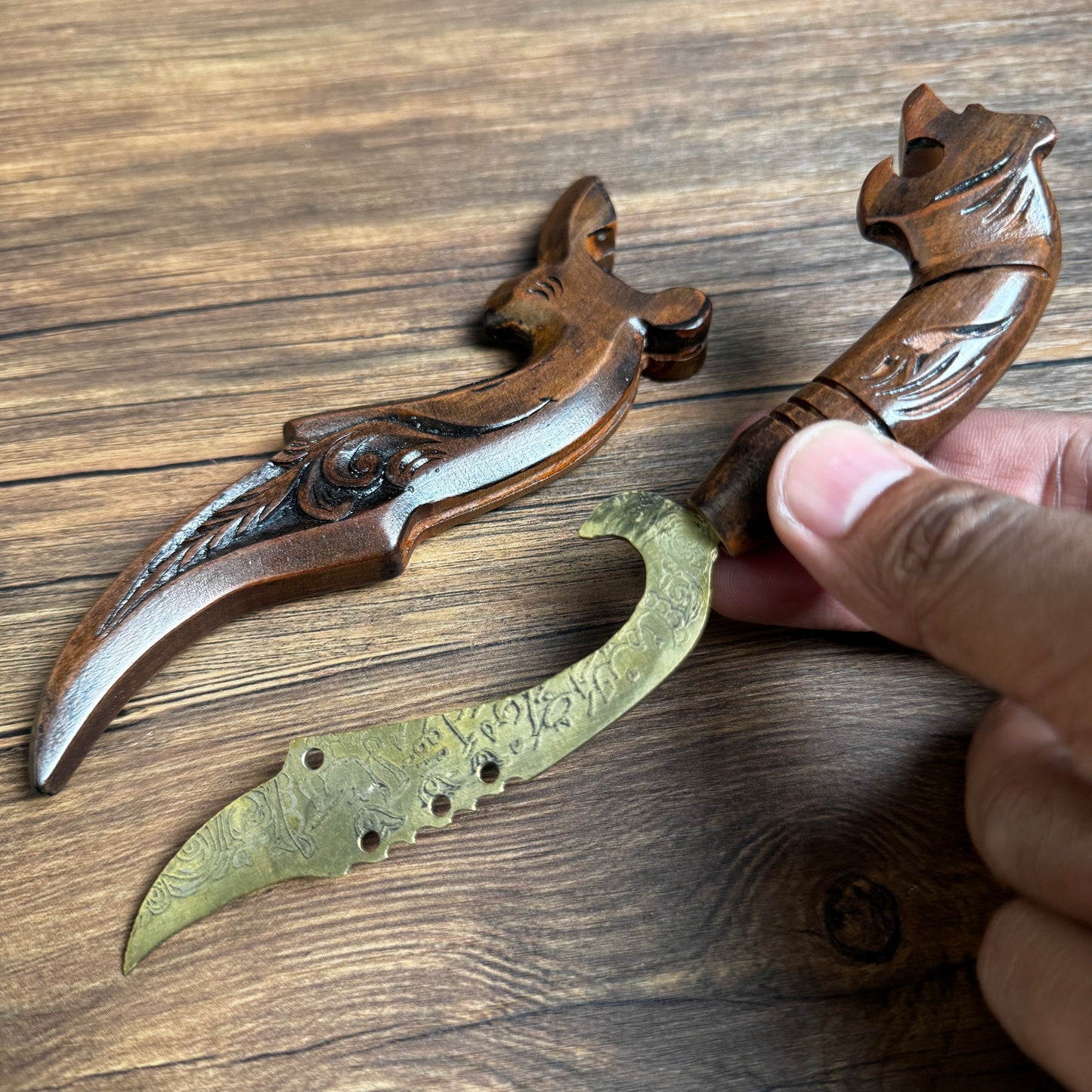 ornate dagger hand forged steel blade side profile close up