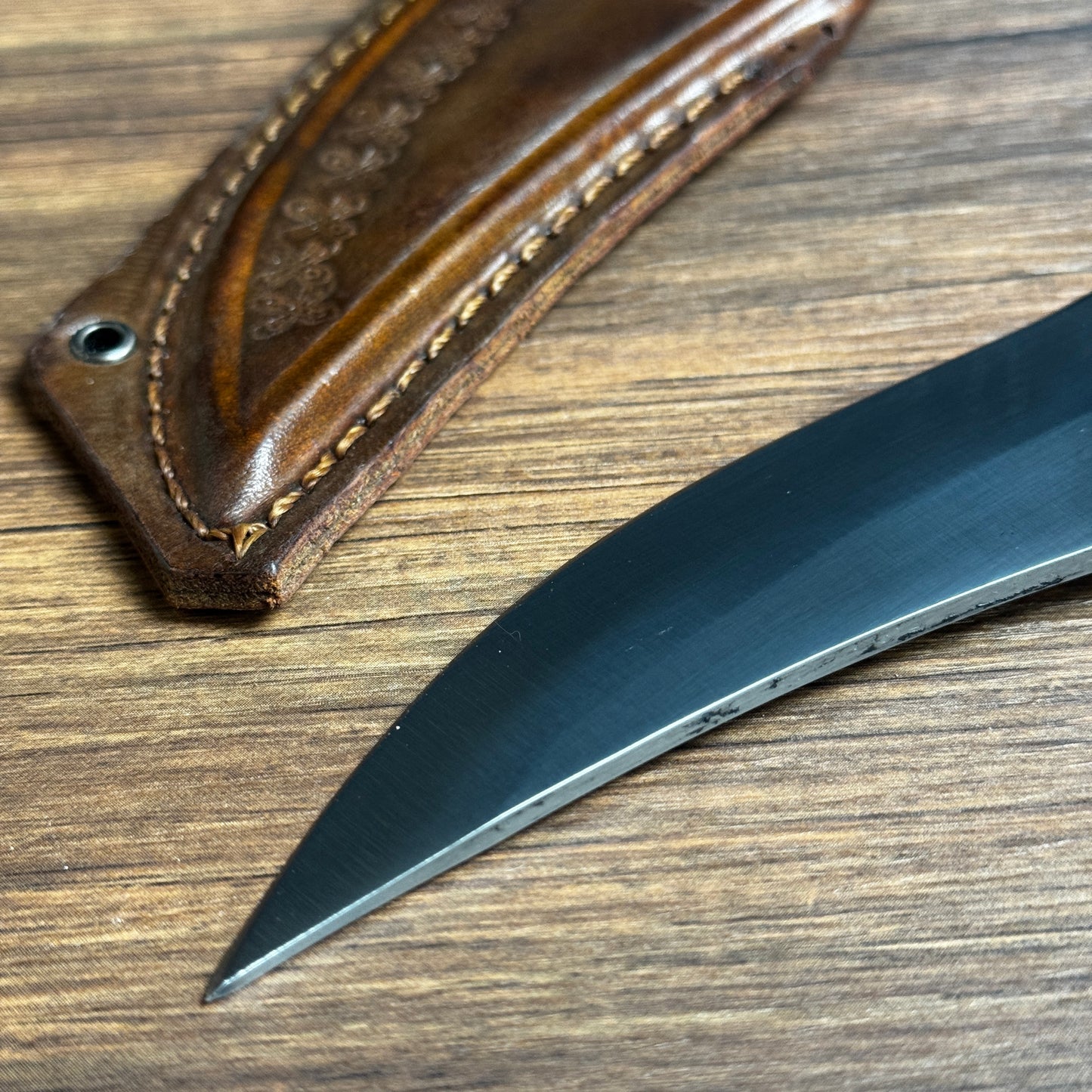 skinning knife with tooled leather sheath